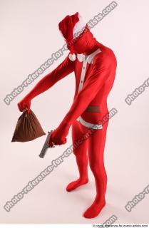 JOEL_ADAMSON CHRISTMAS VALLAIN WITH GUN AND BAG